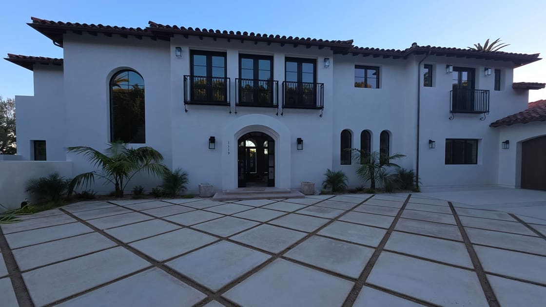 A hillside home with its glass and courtyard cleaned by Over the Top Window Cleaning