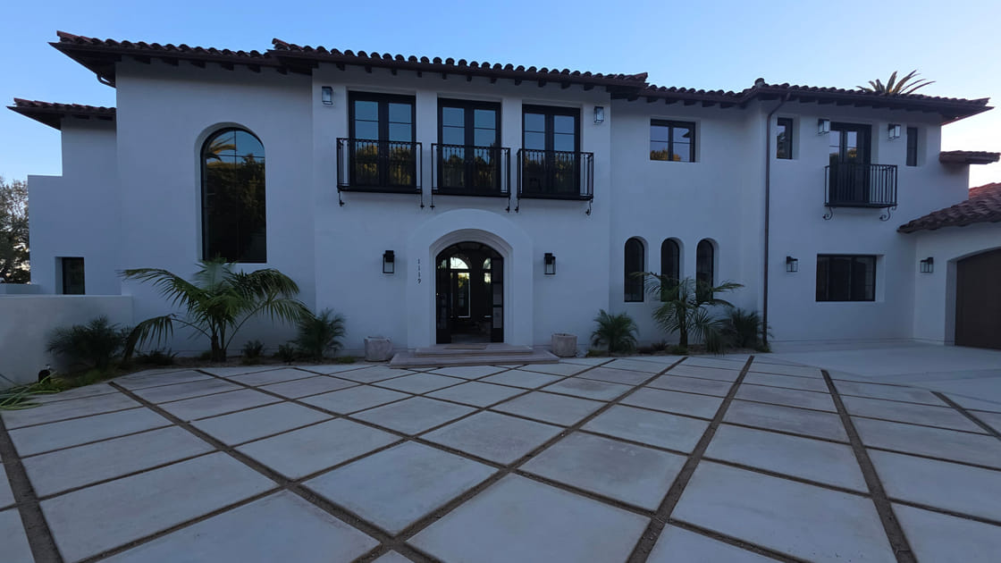 A hillside home with its glass and courtyard cleaned by Over the Top Window Cleaning