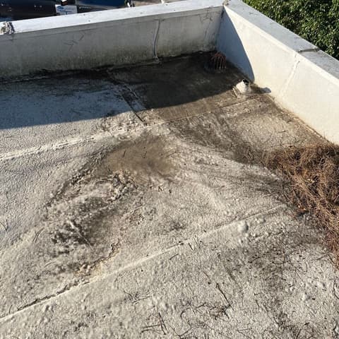 A flat roof washed clean, the grime lifted off the coating
